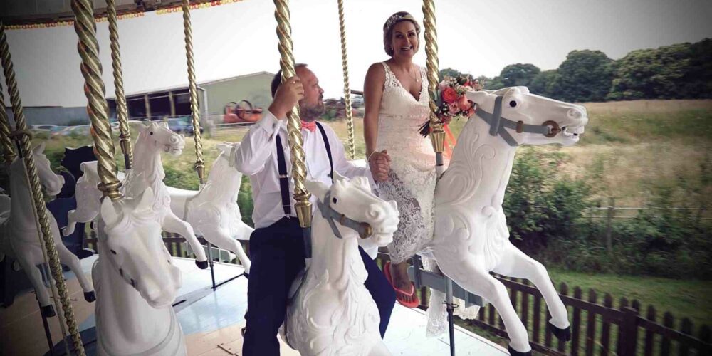 couple on a ride at a wedding